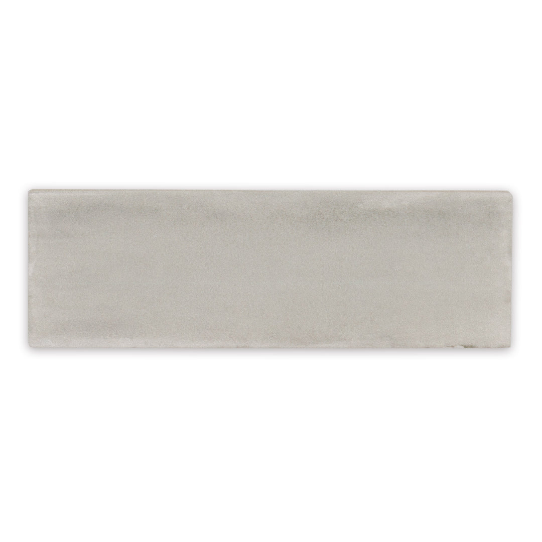 A single 2x6.5 matte sand bars subway tile. 