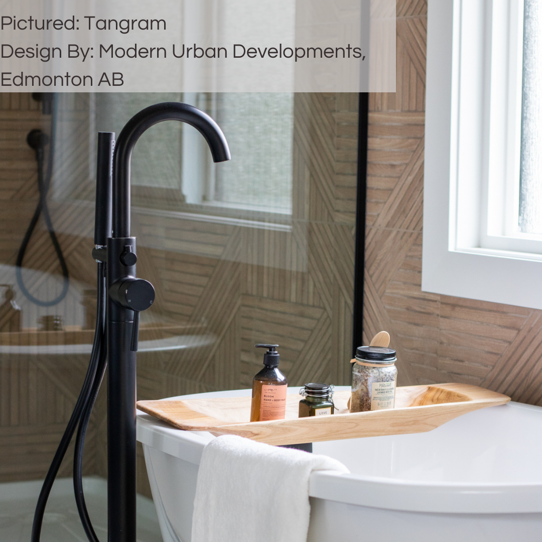 A close up of a bathroom tub and shower, the walls of the room are covered in wood look tiles with a geometric modern pattern in a light brown oak colour. tangram oak