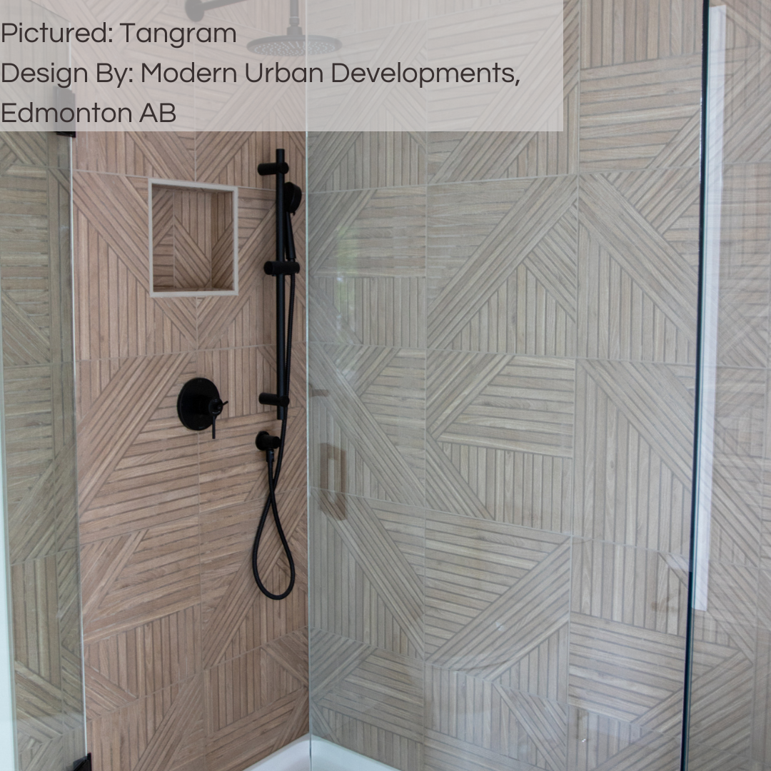 A walk in shower with tangram oak wood look tiles on the walls. the wood grain is light, and the fluted pattern is geometric and adds texture. 