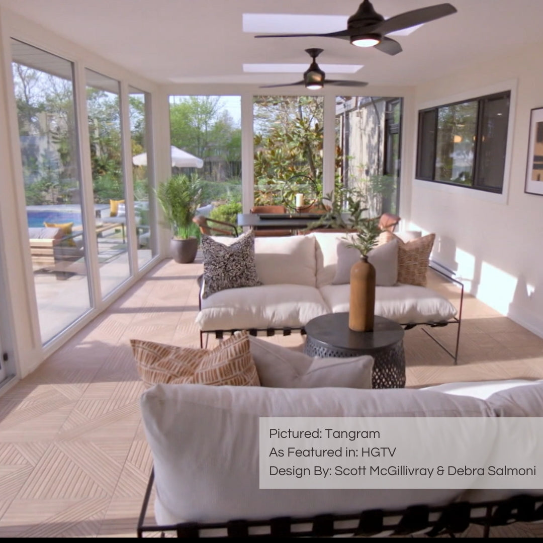 A serene sunroom from hgtv with light and linen finishes, natural decor and bright windows, and tangram oak wood look geometric pattern textured tile floors. 