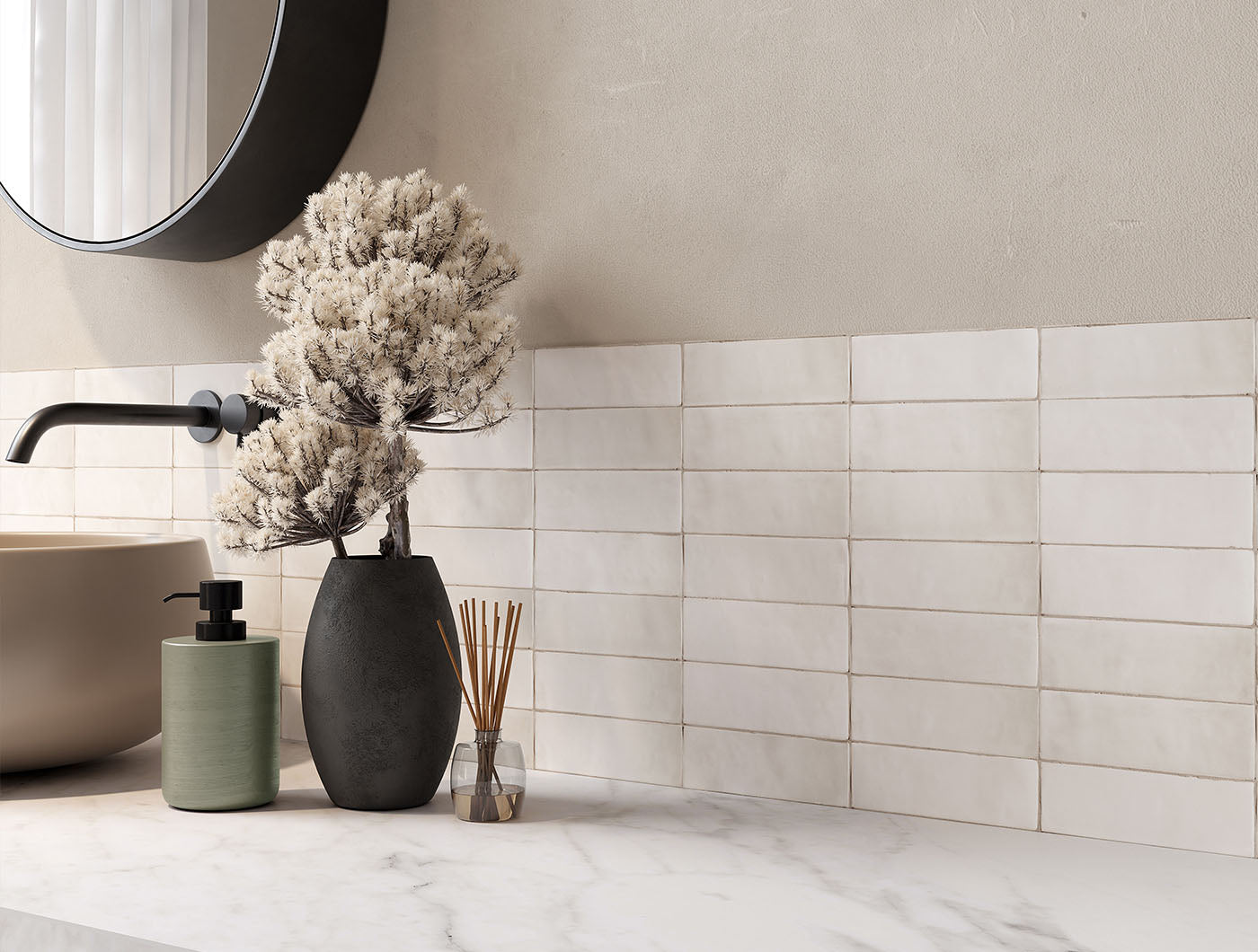 A tiled bathroom backsplash wall featuring 2x6.5 milkstone bars; a matte off white cream tile with heavy colour variation. 