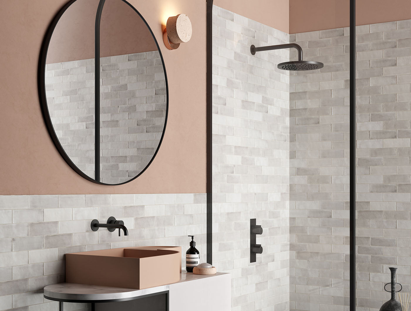 A tiled shower and bathroom vanity wall featuring 2x6.5 misty gray bars; a matte grey silver tile with heavy colour variation. 