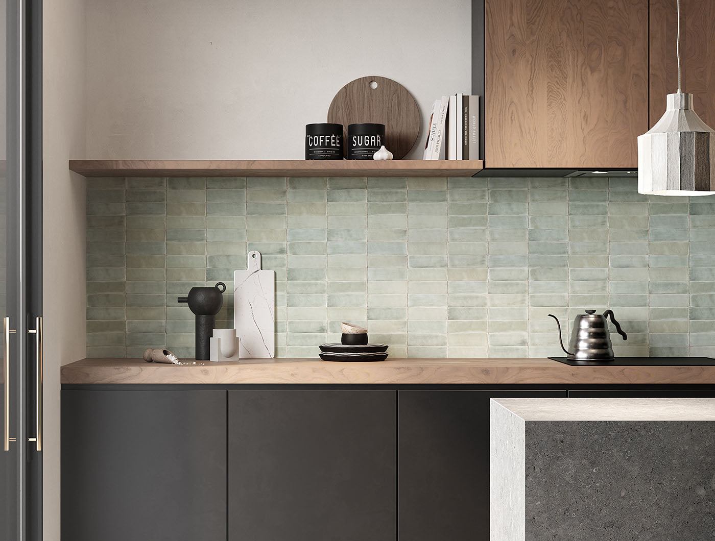 A tiled kitchen backsplash wall featuring 2x6.5 seaside bars in a modern stacked pattern; a matte light coastal sage green tile with heavy colour variation. 