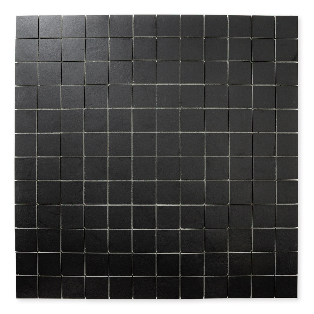 A far away ariel view of the 12x12 sheet mosaic tile made of 2x2 black stone look tiles with a subtle texture