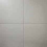 Grey 12x12 tile ariel view of four square  tiles together with a soft stone appearance and texture. 
