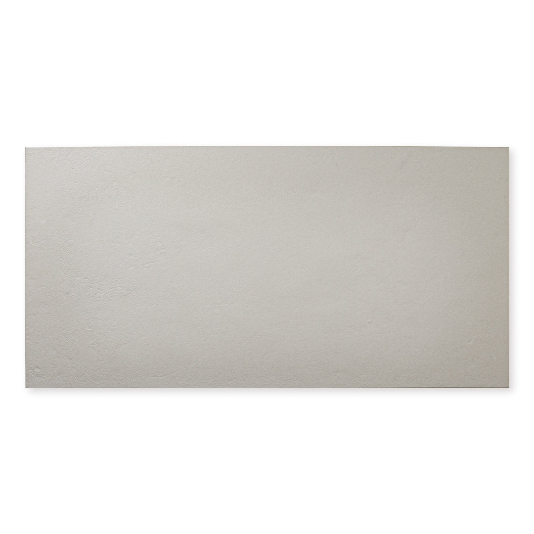 Single tile photo of the 12x24 grey tile with a soft stone appearance and texture. 
