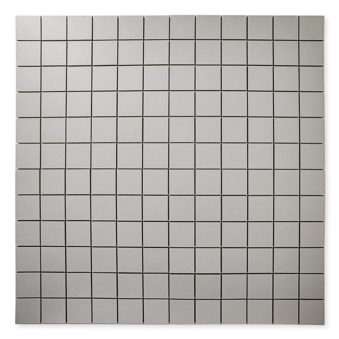 A far away ariel view to capture the full size of the 12x12 sheet mosaic tile made of 2x2 grey stone look tiles with a subtle texture