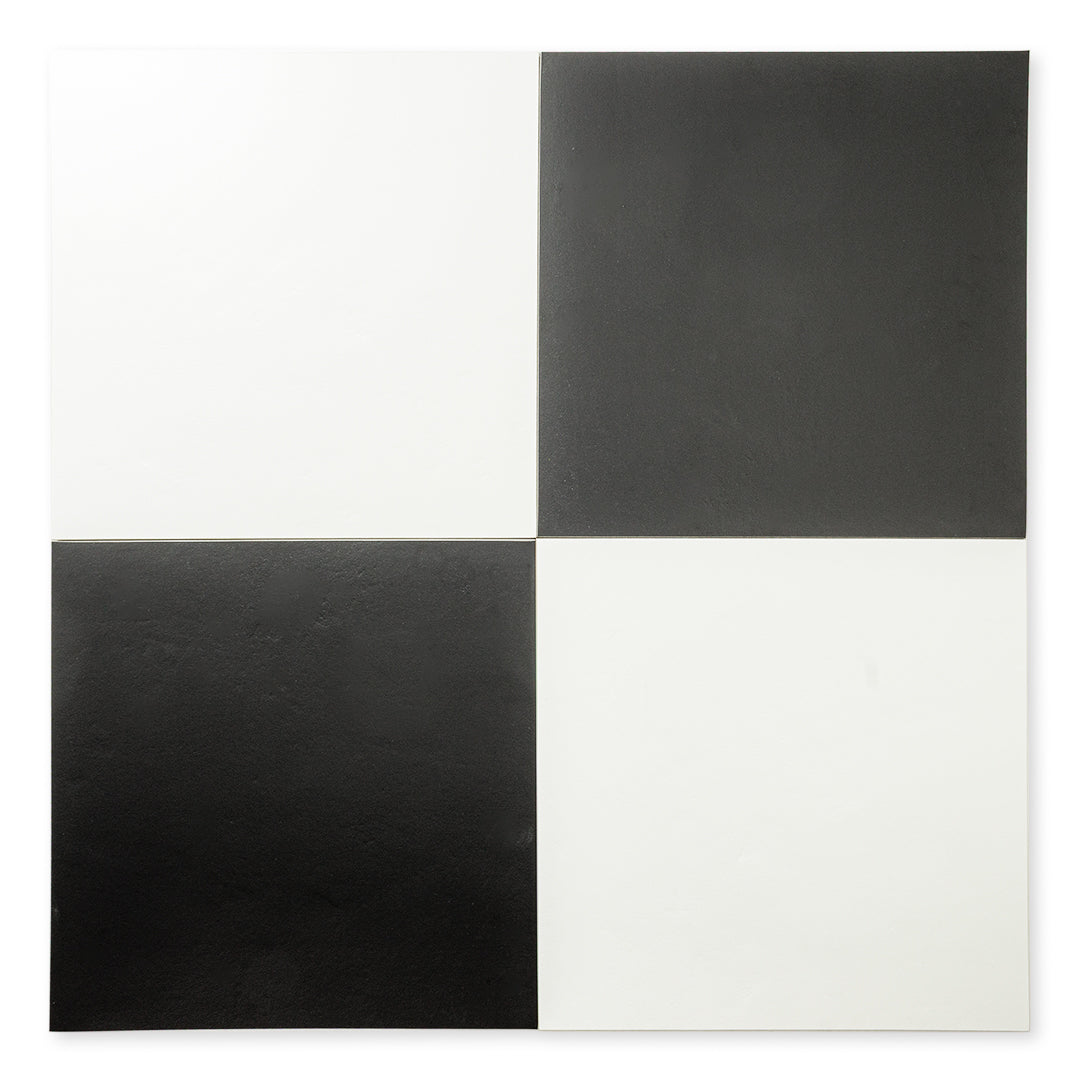 Ariel view of 2 white and 2 black tiles laid in a checkerboard pattern. Checkmate White 12x12 and Checkmate Black 12x12, these two tiles feature a slight stone look, with subtle texture and a matte finish. 