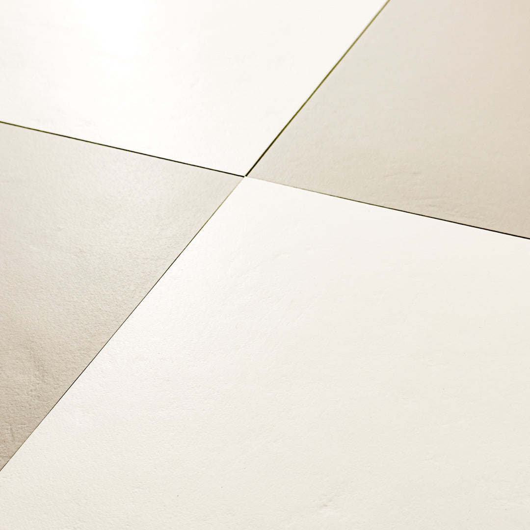 Grey  and white 12x12 tile ariel view of four square checkerboard tiles together with a soft stone appearance and texture. 