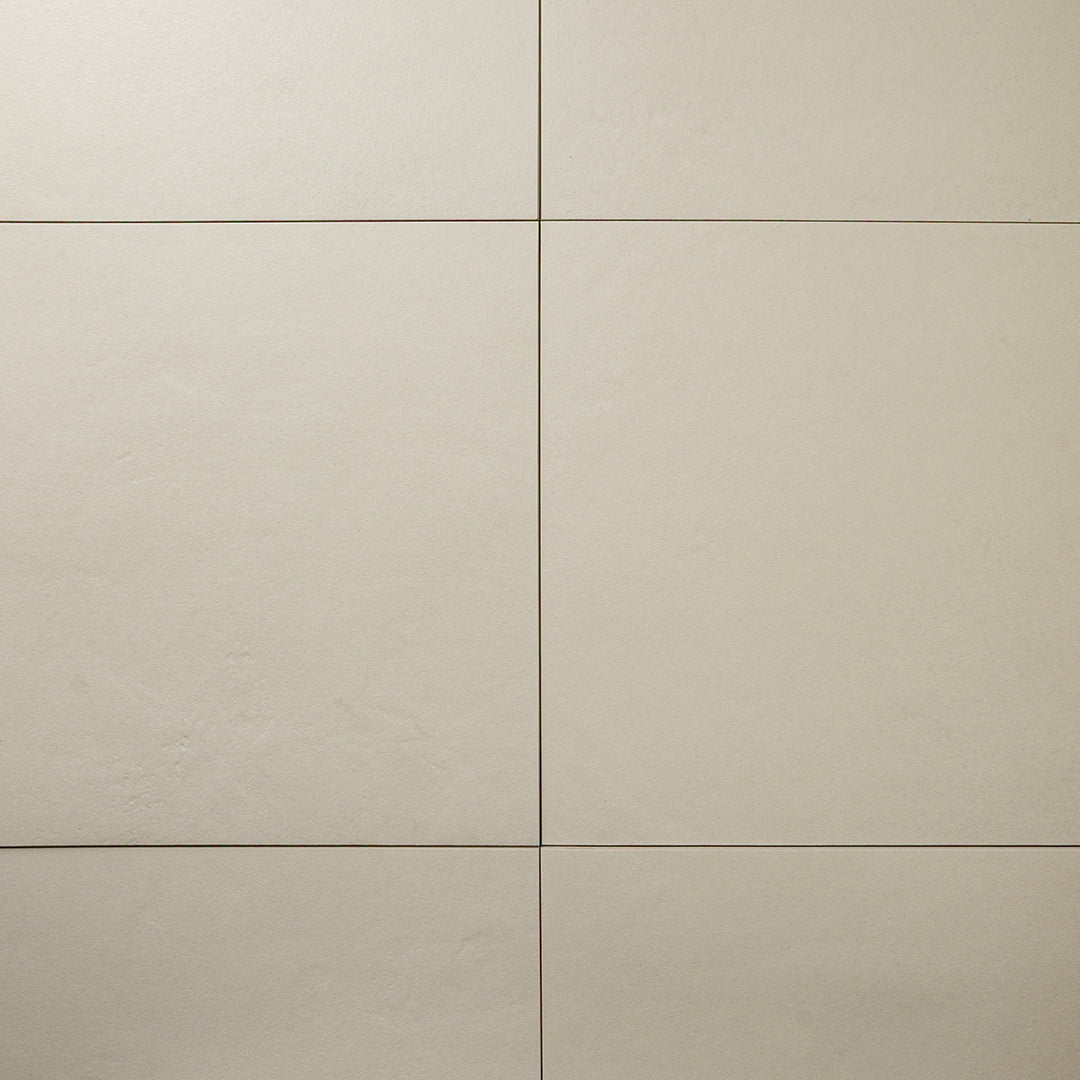 Beige 12x12 tile ariel view of six square  tiles together with a soft stone appearance and texture. 