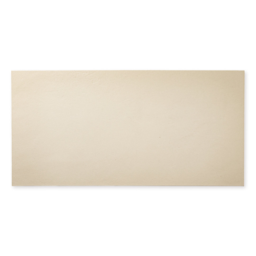 A single tile of the 12x24 beige tile featuring the soft stone appearance and texture. 