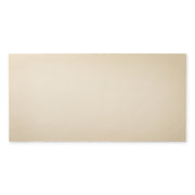 A single tile of the 12x24 beige tile featuring the soft stone appearance and texture. 