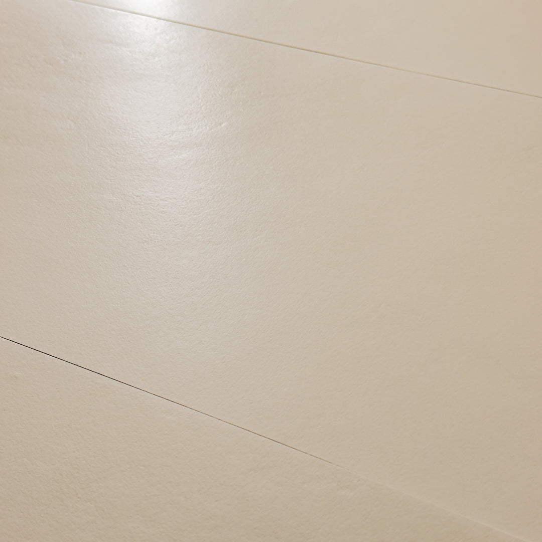 A close up view of the 12x24 beige tile highlighting the soft stone appearance and texture. 