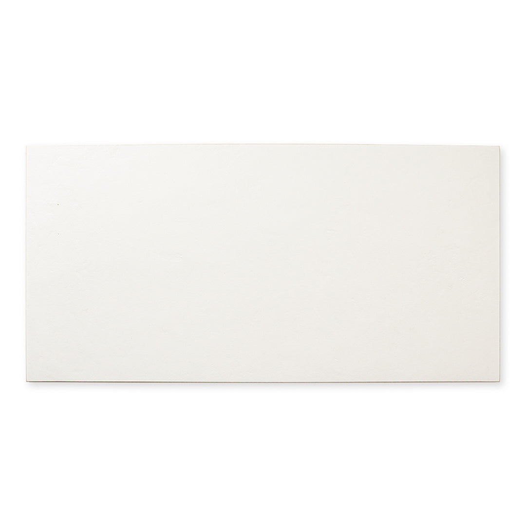 Single tile photo of the 12x24 white tile with a soft stone appearance and texture. 