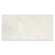 Ariel view of a single large rectangular 12x24 tile that resembles travertine stone in light grey white. 