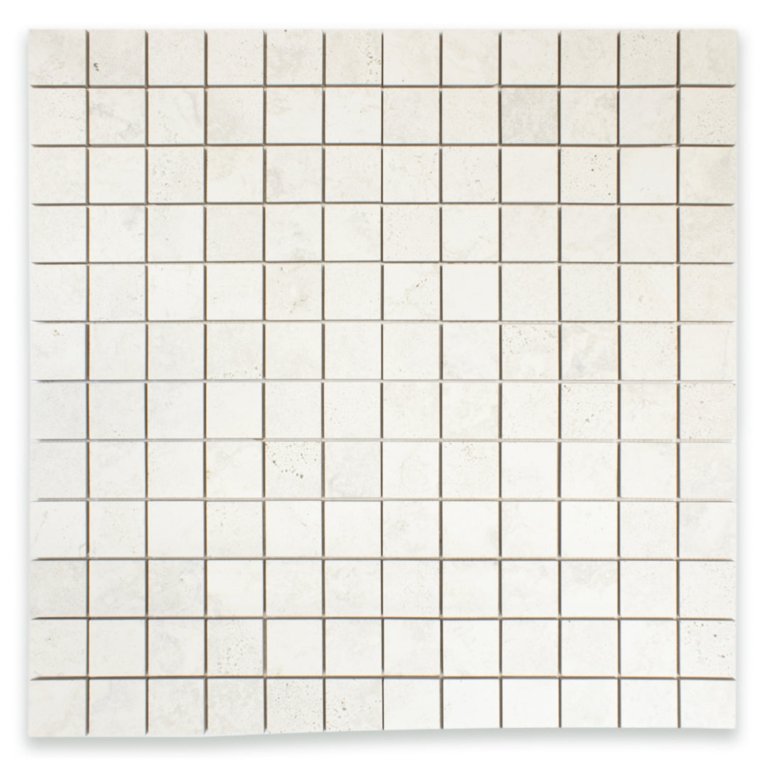 Ariel view of a 2x2 square mosaic tile that resembles travertine stone in light grey white. 