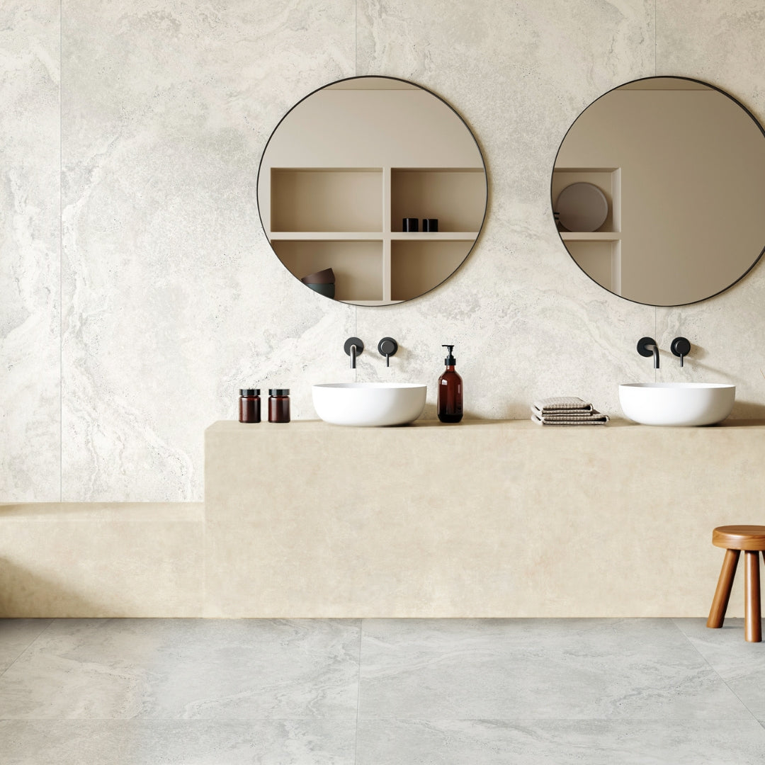 A neutral bathroom setting with modern elements. The floor and sink back splash tile are 24x48 travertine stone look porcelain in light grey white. 