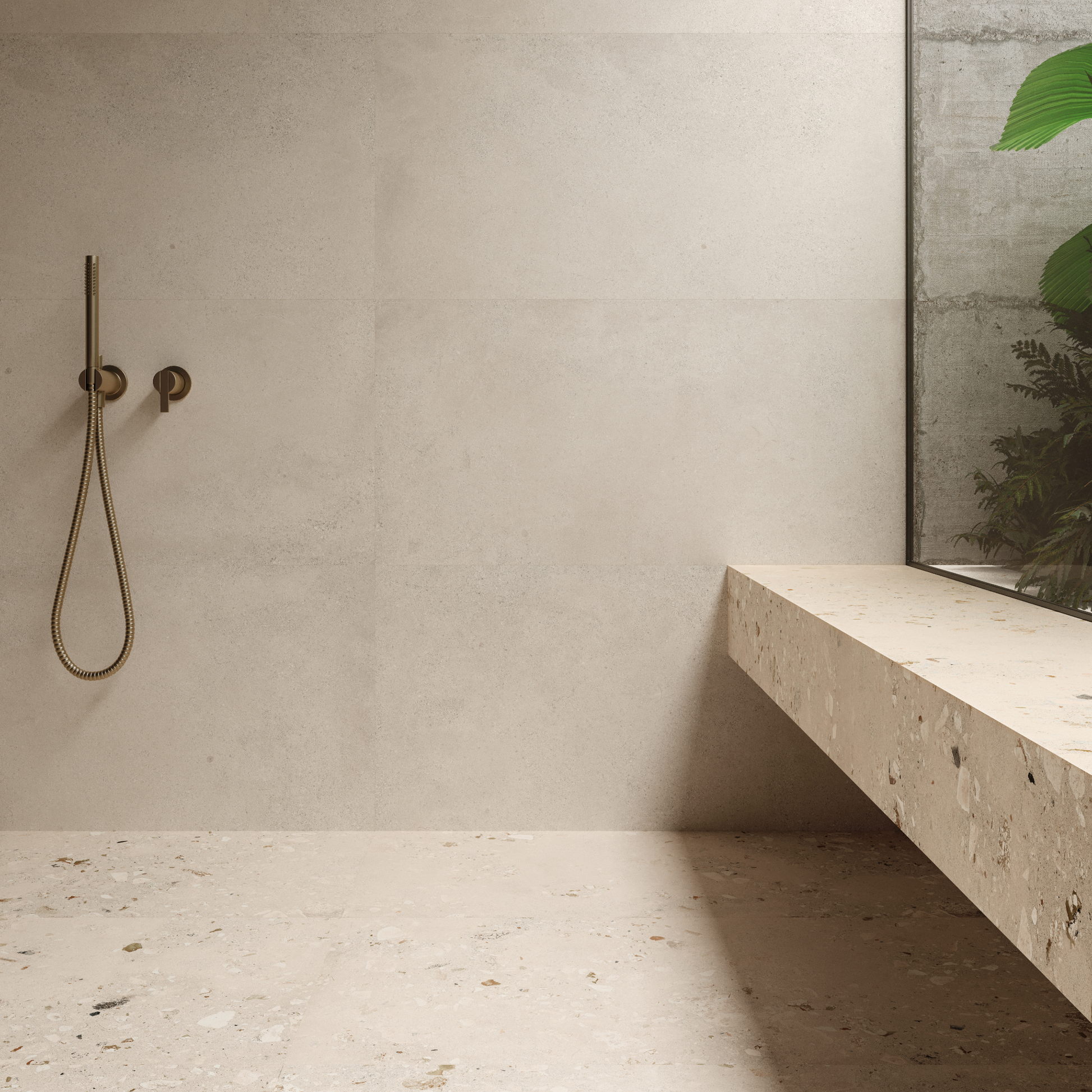 a large luxurious walk in shower with terrazzo cement look 26x36 tiles on the floor in a light base. the shower bench matches in the same. 