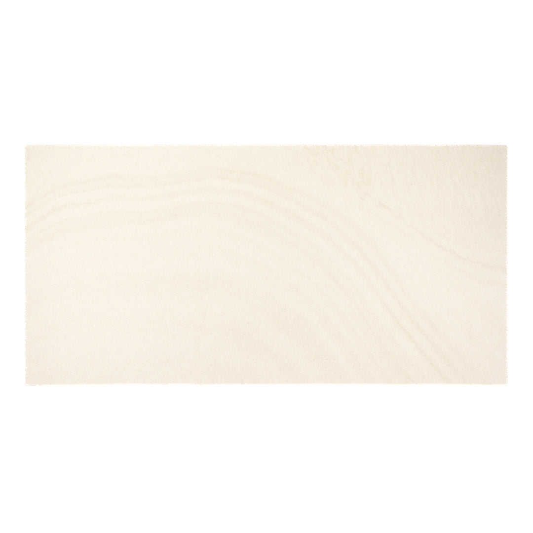 a single rectangular wavey stone pattern tile in a warm beige colour and matte finish perfect for floors and walls in commercial and residential settings