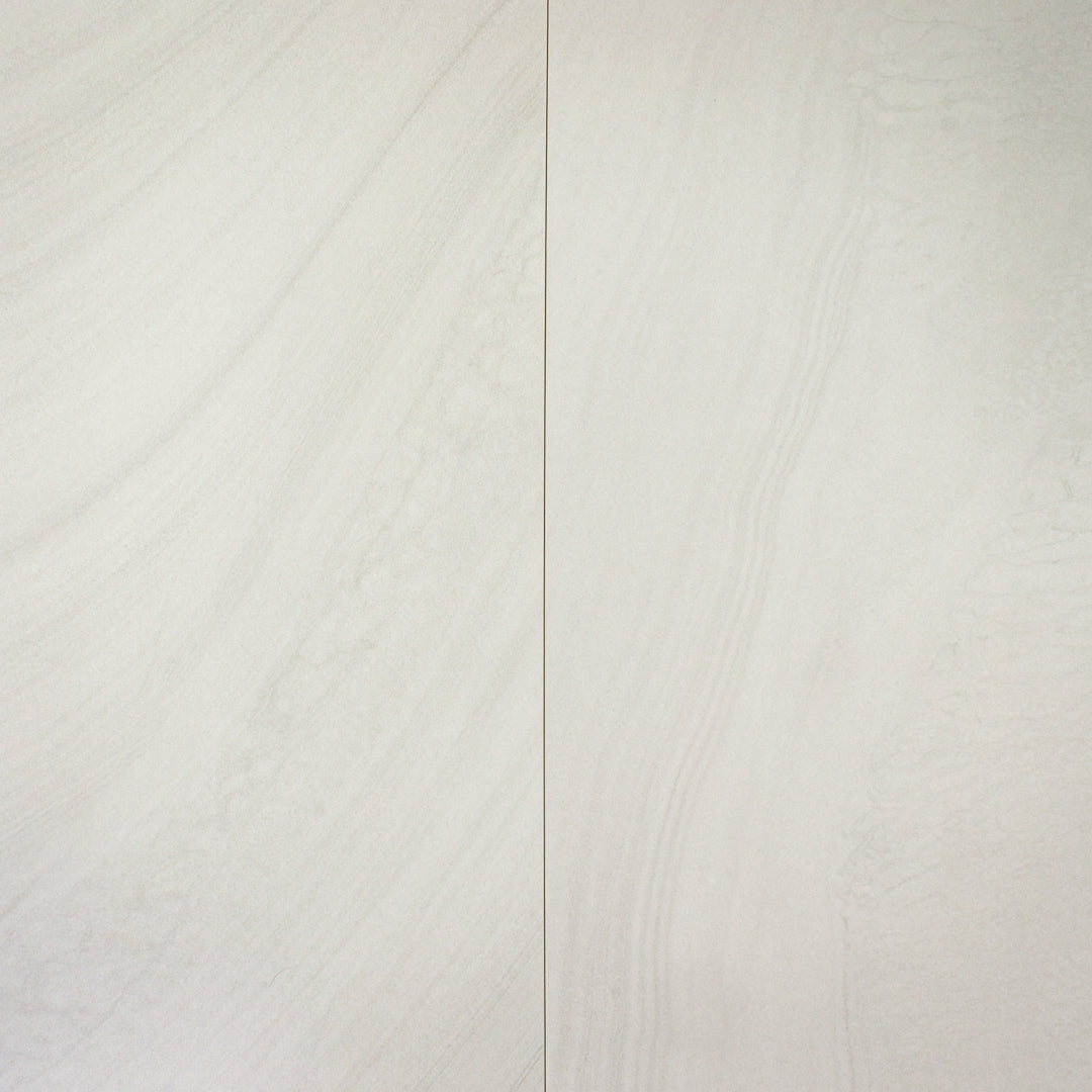 two large stone look tilesinspired solenne grey tiles side by side to show the flow of the slight stone pattern