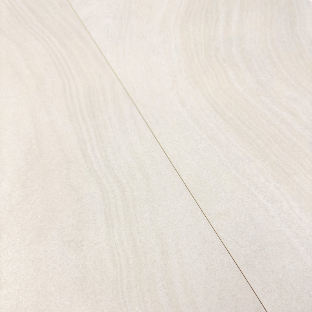 Two side by side olenne white stone look rectangle large tiles showing the subtle swirly agate like stone pattern