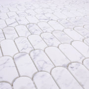 Close Up angled view of white and grey veining marble look porcelain feather scallop mosaic tiles.