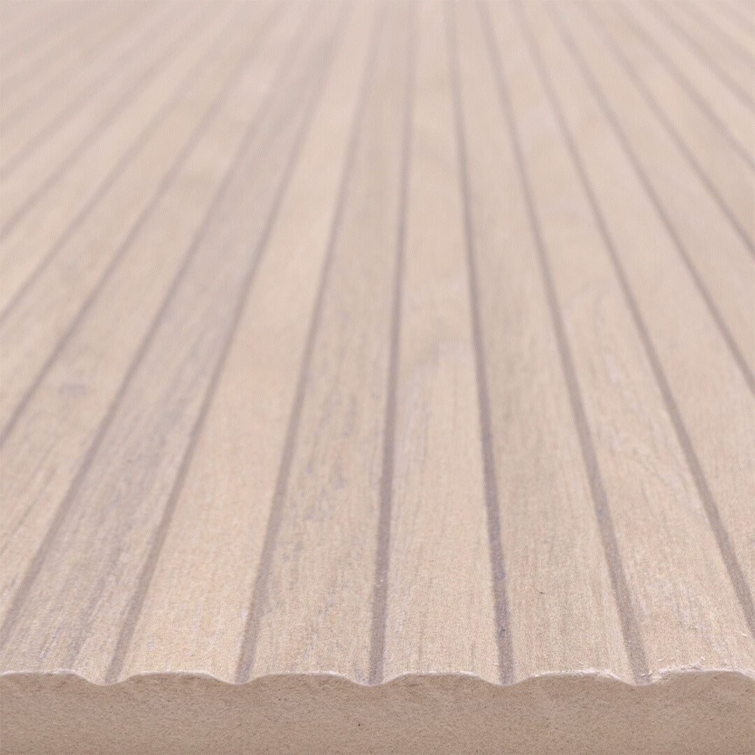 Angled close up of a 13x40 wood look reeded tile in a light birch blonde colour. 