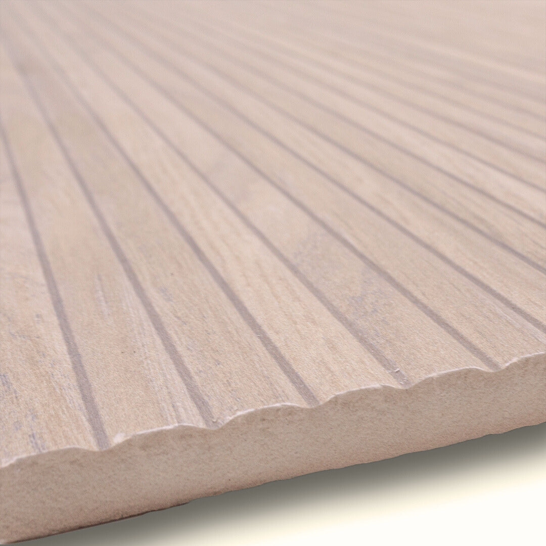 Angled close up to show the texture of the 13x40 wood look reeded tile in a light birch blonde colour. 
