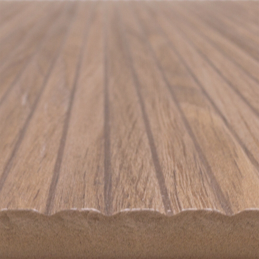 Angled close up of a 13x40 wood look reeded tile in a brown oak colour. 