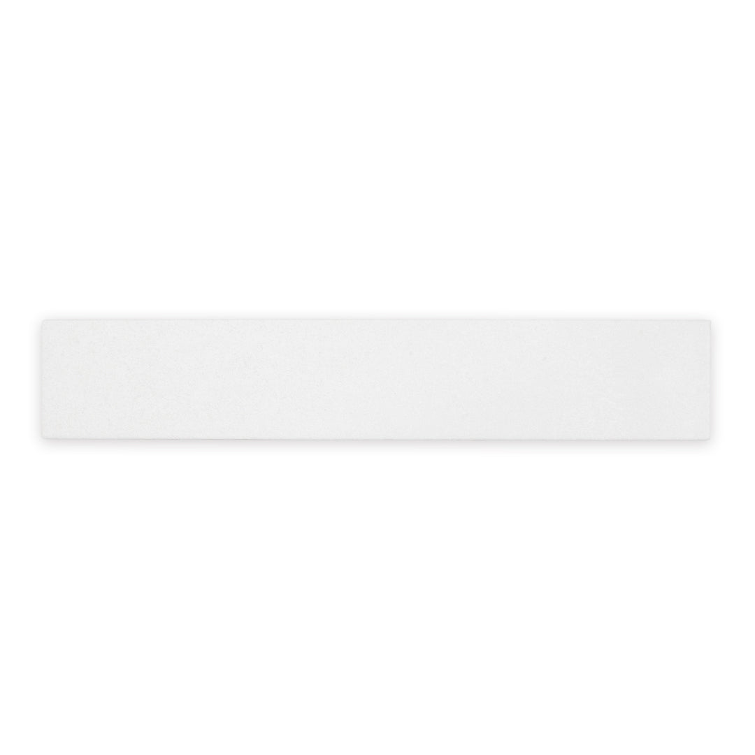 A white 17.5" X 3.25" plank look tile with subtle texture and pattern for floors or walls. 