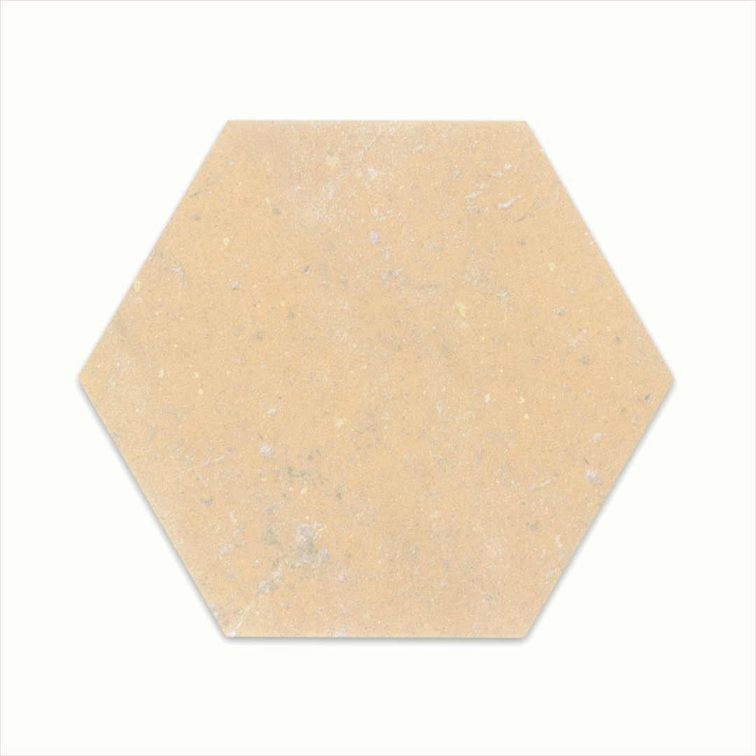 A single 6" hexagon clay sand beige light terracotta stone look tile