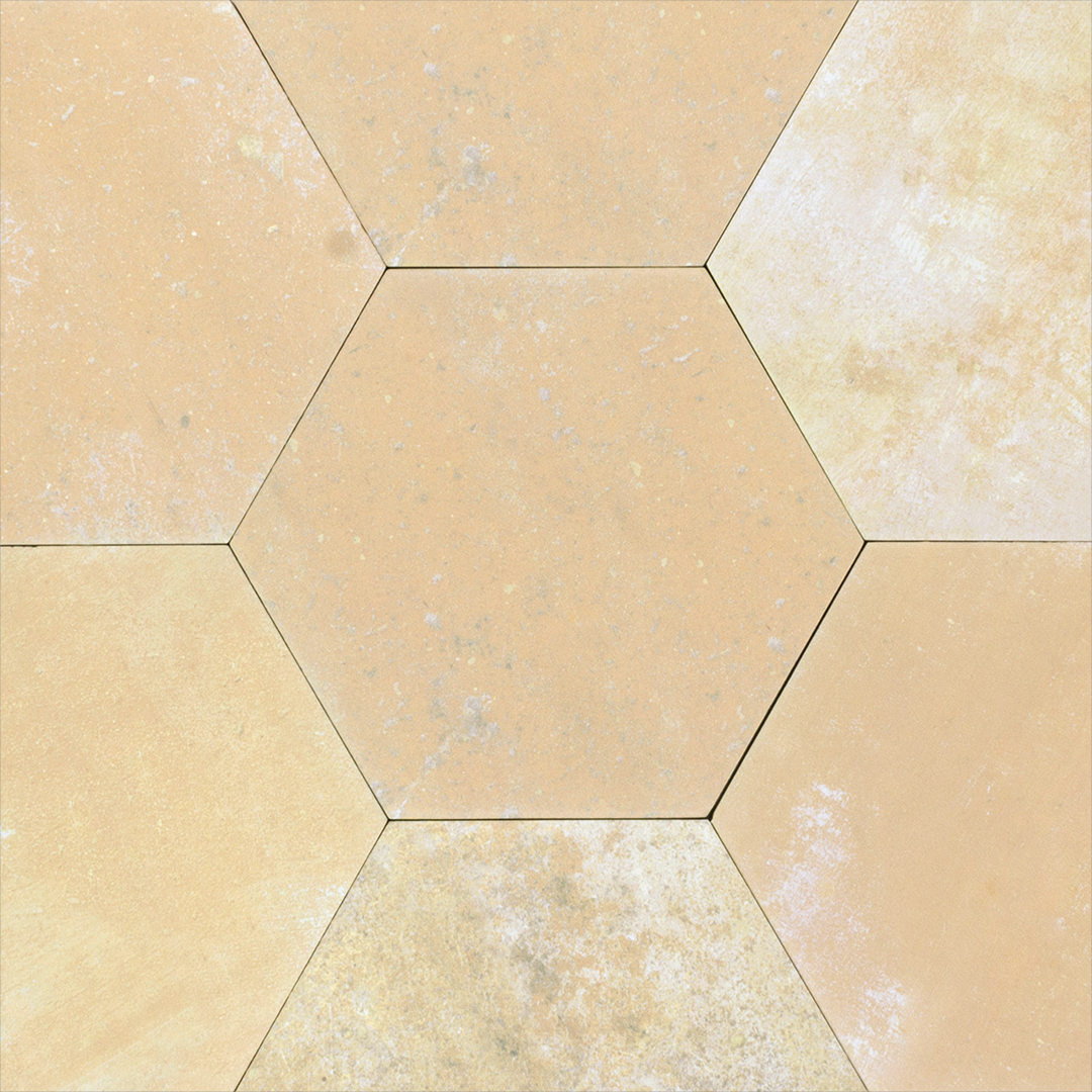 A group of 6" hexagon clay sand beige light terracotta stone look tile