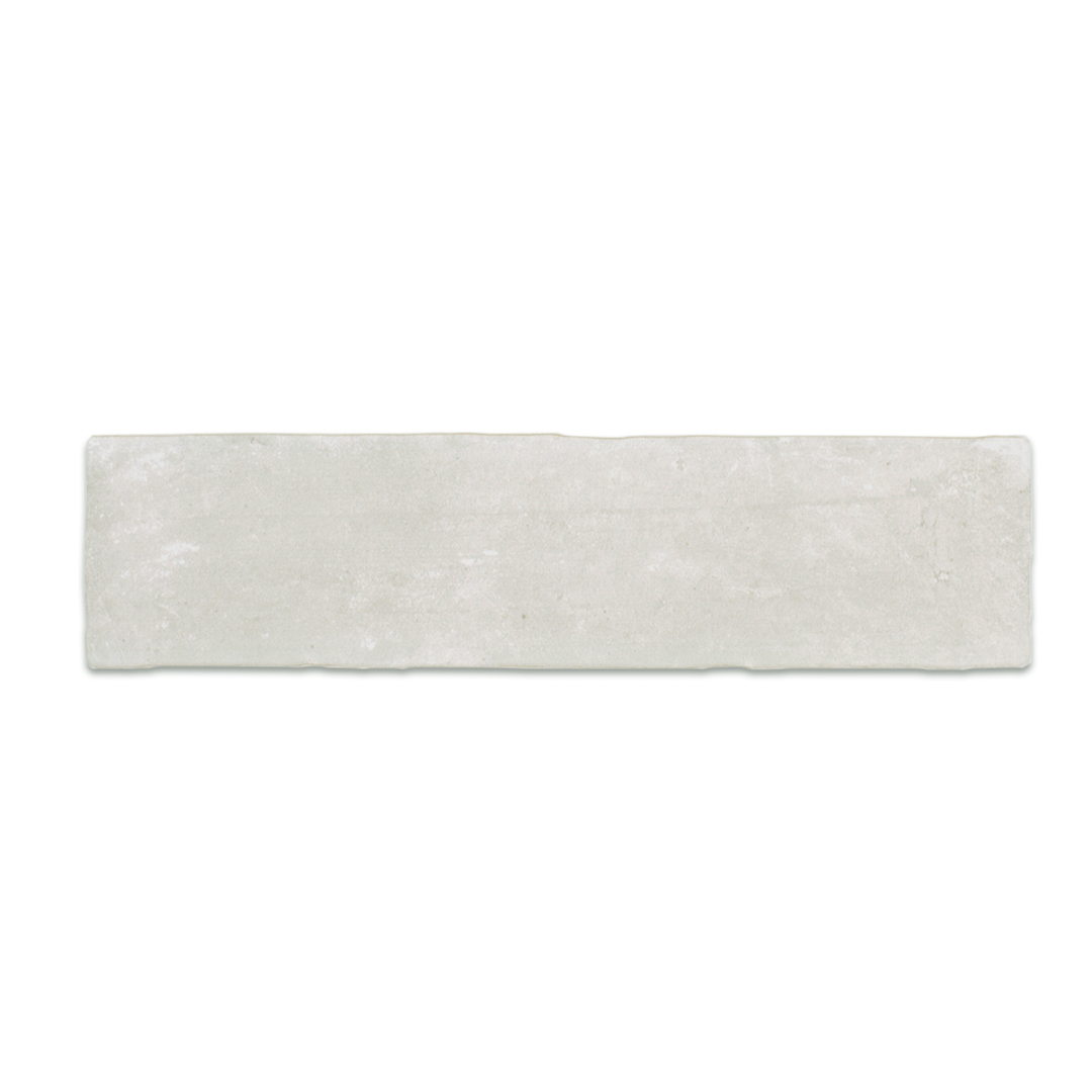 A single 11x2.75 brick clay silver cement grey stone look tile with a natural looking edge