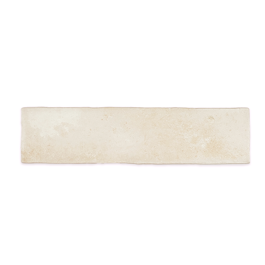 A single 11x2.75 brick clay chalk white stone look tile with a natural looking edge