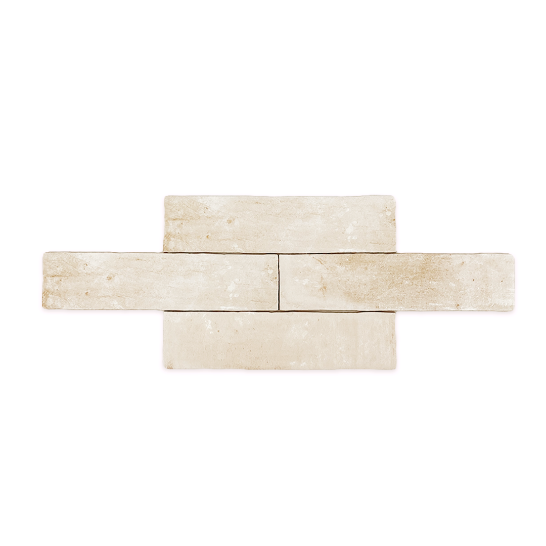 A group of 11x2.75 brick clay chalk white stone look tiles with a natural looking edge, worn pattern and matte finish