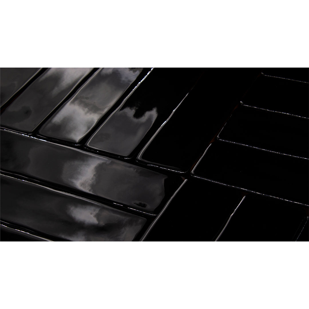 A timeless classic 2x10 black skinny subway tile in glossy. 
