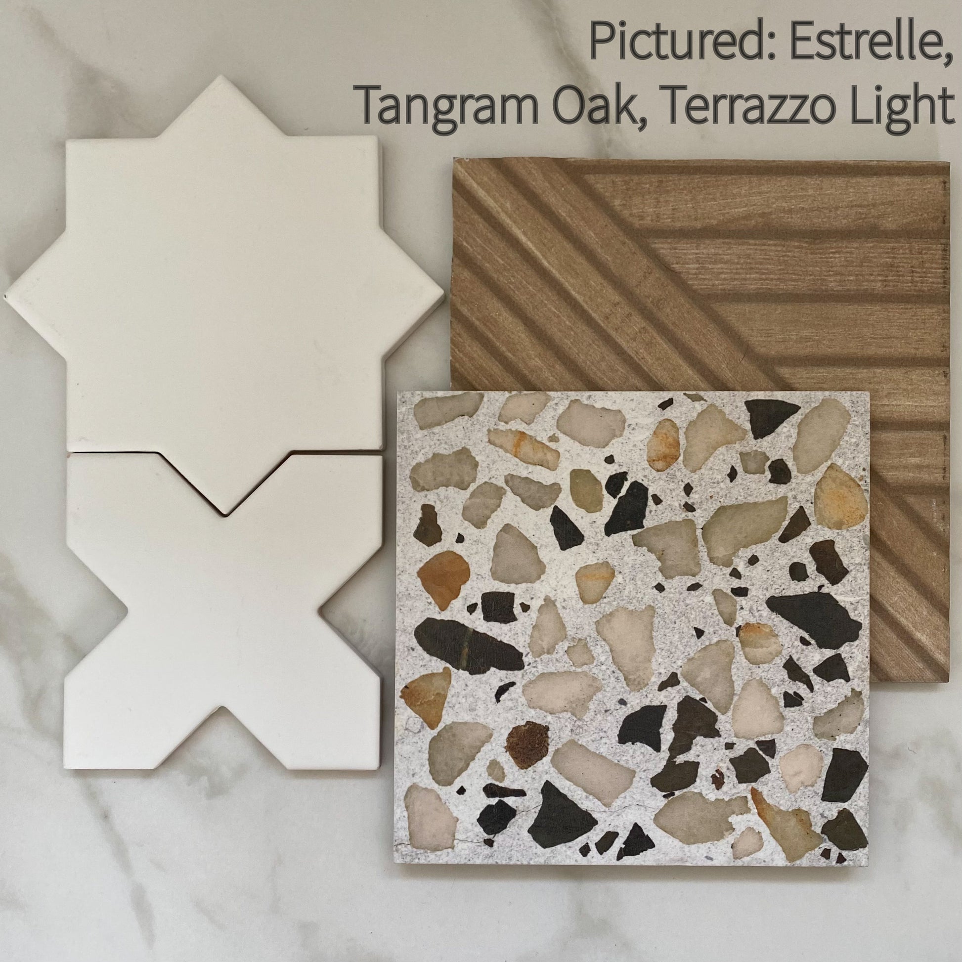 Tiles that compliment eachother terrazzo look and tangram oak wood look pattern tiles along with white estrelle star and cross shapes tiles. 