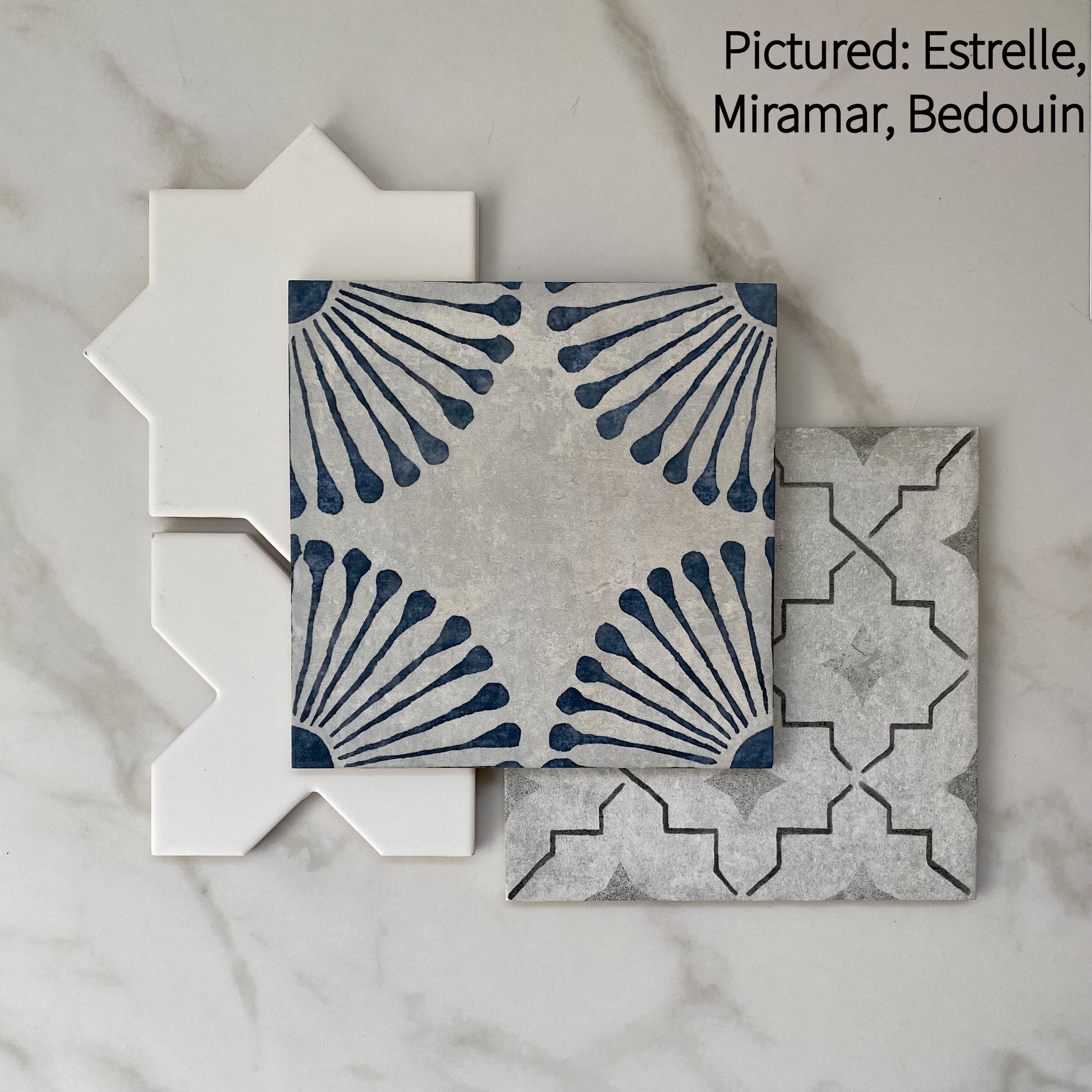 Tiles that compliment each other miramar and bedouin blue and grey pattern tiles along with white estrelle star and cross shapes tiles. 