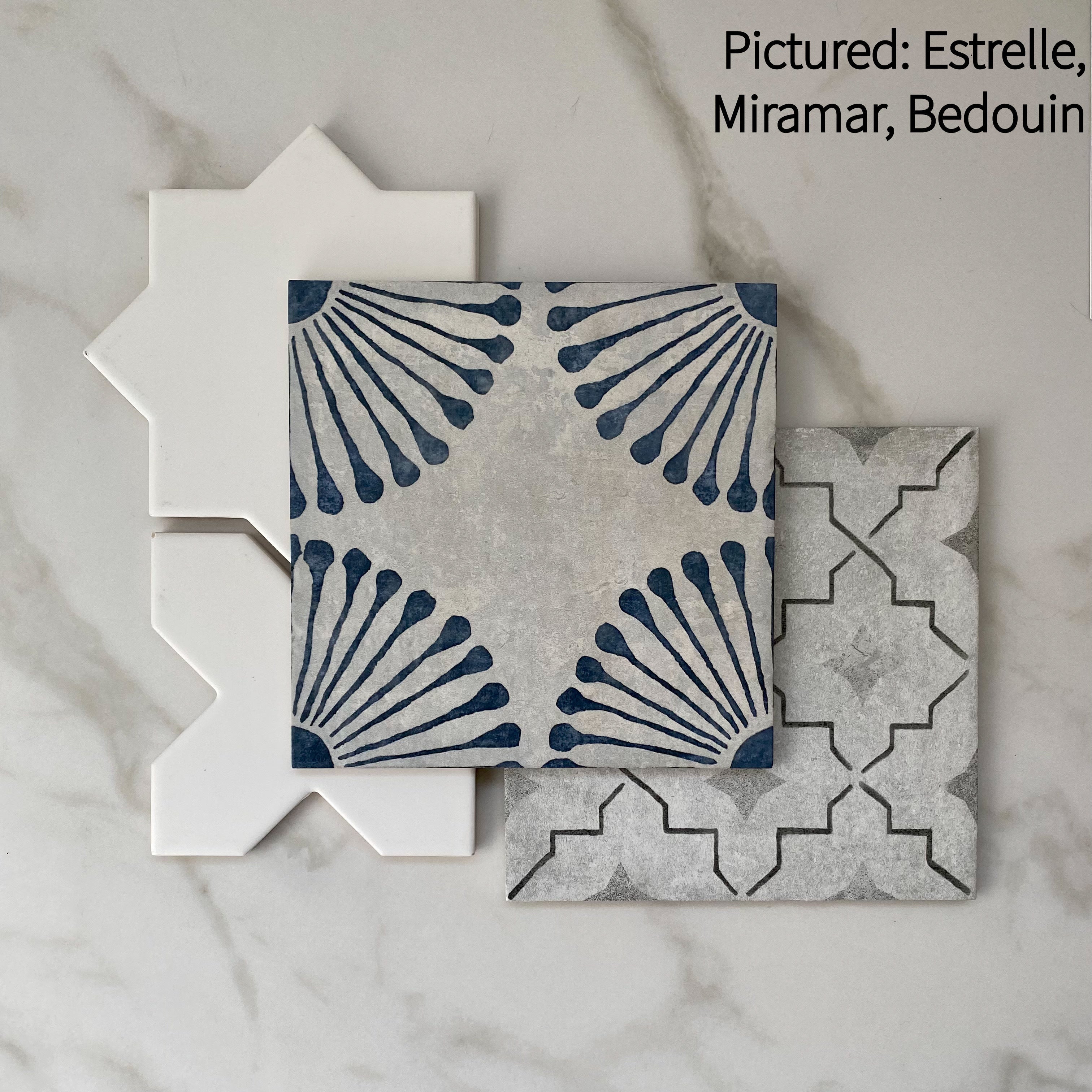 Tiles that compliment each other miramar and bedouin blue and grey pattern tiles along with white estrelle star and cross shapes tiles. 