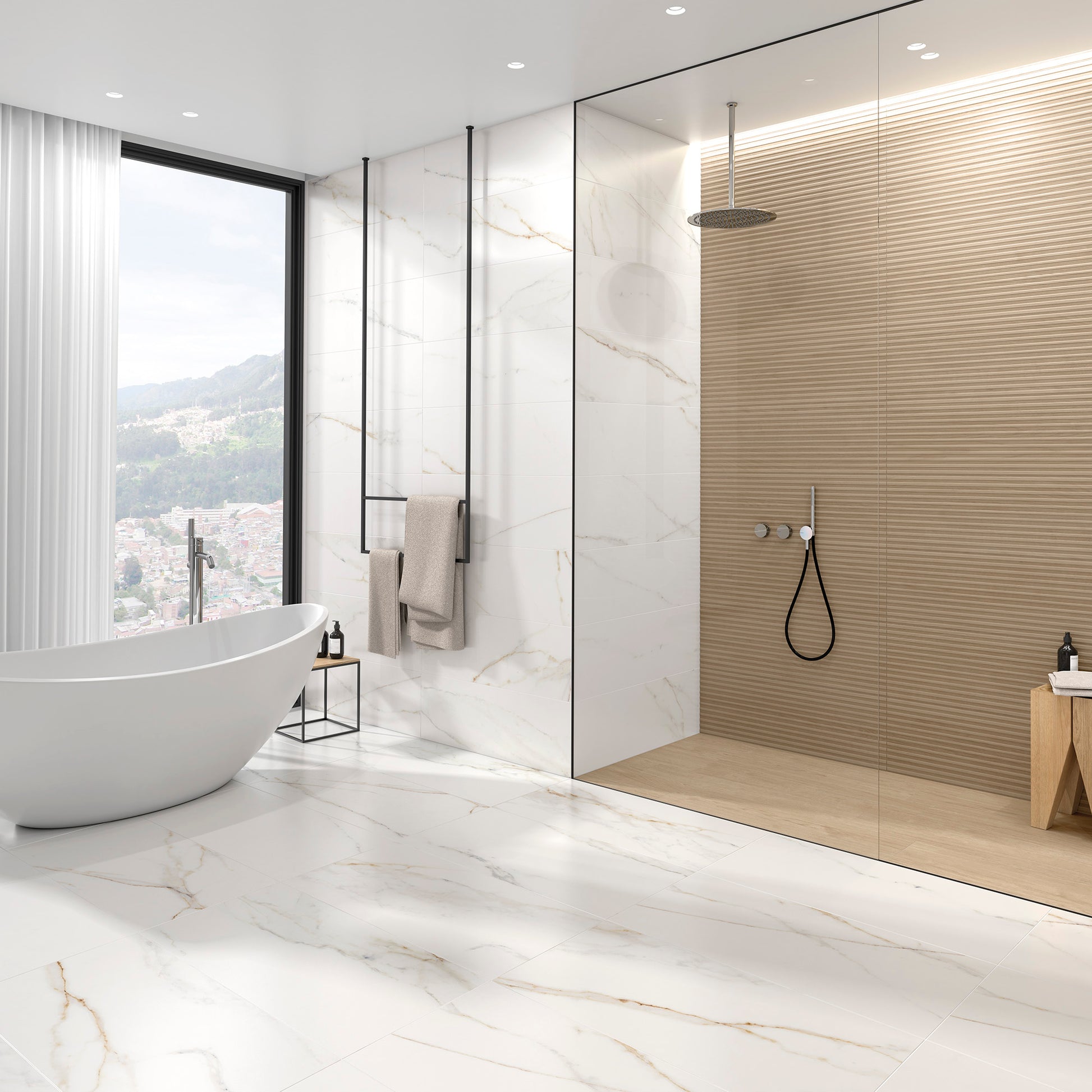 A modern washroom with bright white marble floors, and white tub. The shower has reeded vanilla wood look tiles for texture on the walls, and vanilla plank wood look tiles on the shower floor to match! 