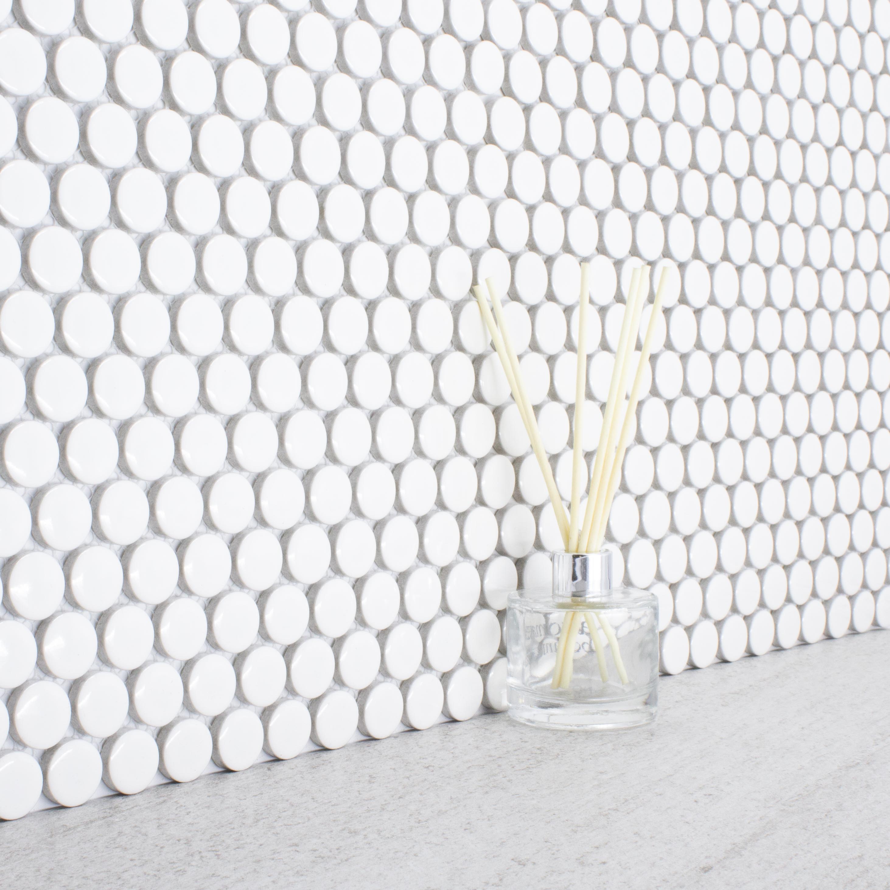 angled close up of polka dot penny round white tiles 