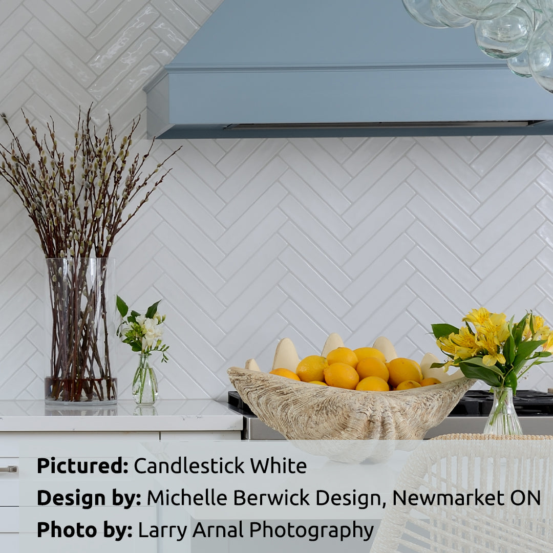 Candlestick White Spanish Ceramic Tile 10x2 Glossy. Installed in herringbone in a Kitchen Backsplash. Tile from Cevica and TilesInspired